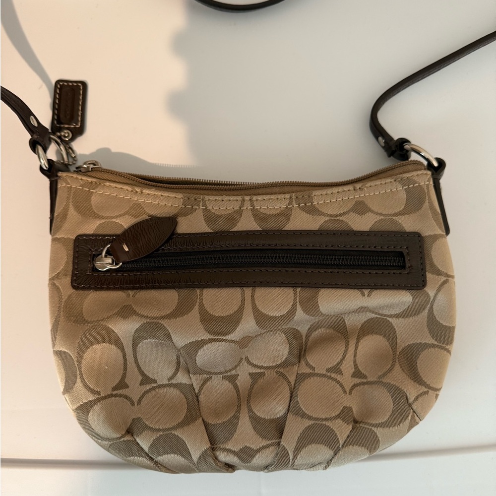 Coach Tan and Brown Crossbody Bag with Signature Pattern and Curved Shape